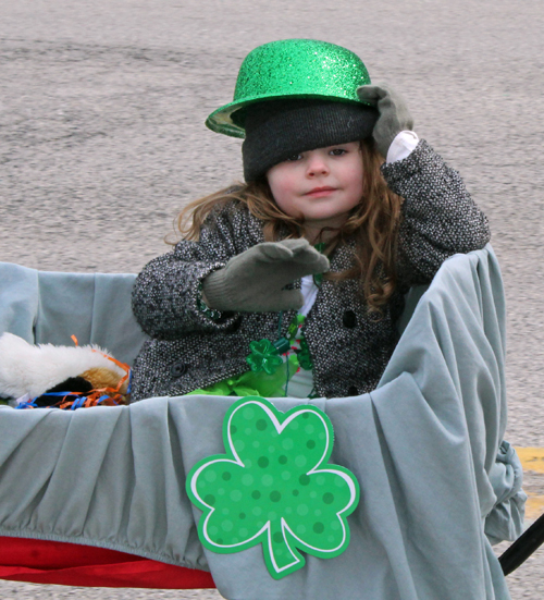 little girl in wagon - 2019 Cleveland St. Patrick's Day Parade